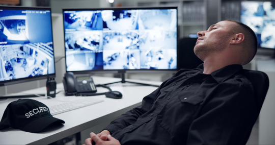 Security guard, computer screen and tired by CCTV monitor for protection