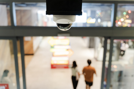 surveillance camera monitoring the entrance of building