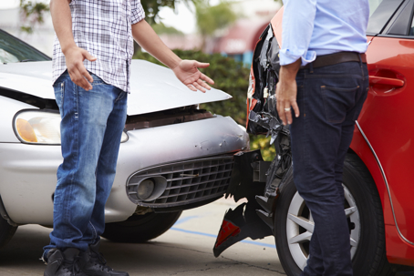 two men in an accident having a discussion