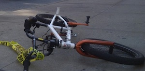 Bicycle laying on the ground with a do no cross tape