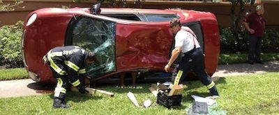 Two Men working on a car accident