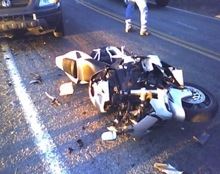 Totally wrecked white motorcycle